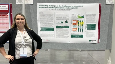 Angela Johnson with her ASH 2023 poster on generics and biosimilars in non-Hodgkin's lymphoma therapeutics